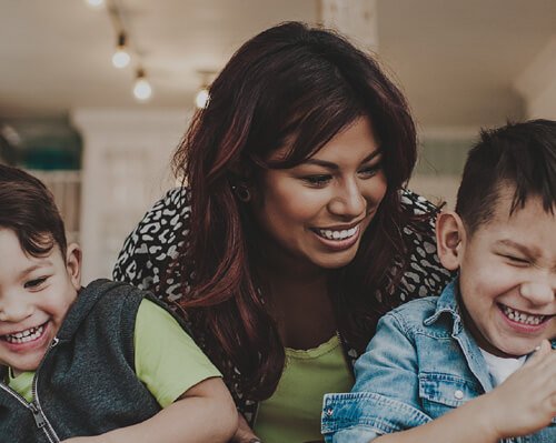 HelpingMinds<sup>®</sup> YoungMinds brochure header with laughing mother and two happy sons
