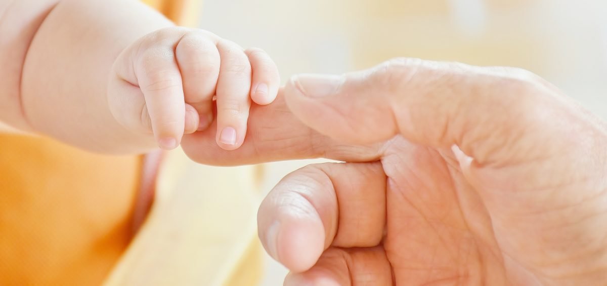 Baby clinging onto parent's finger header for Perinatal Depression and Anxiety post